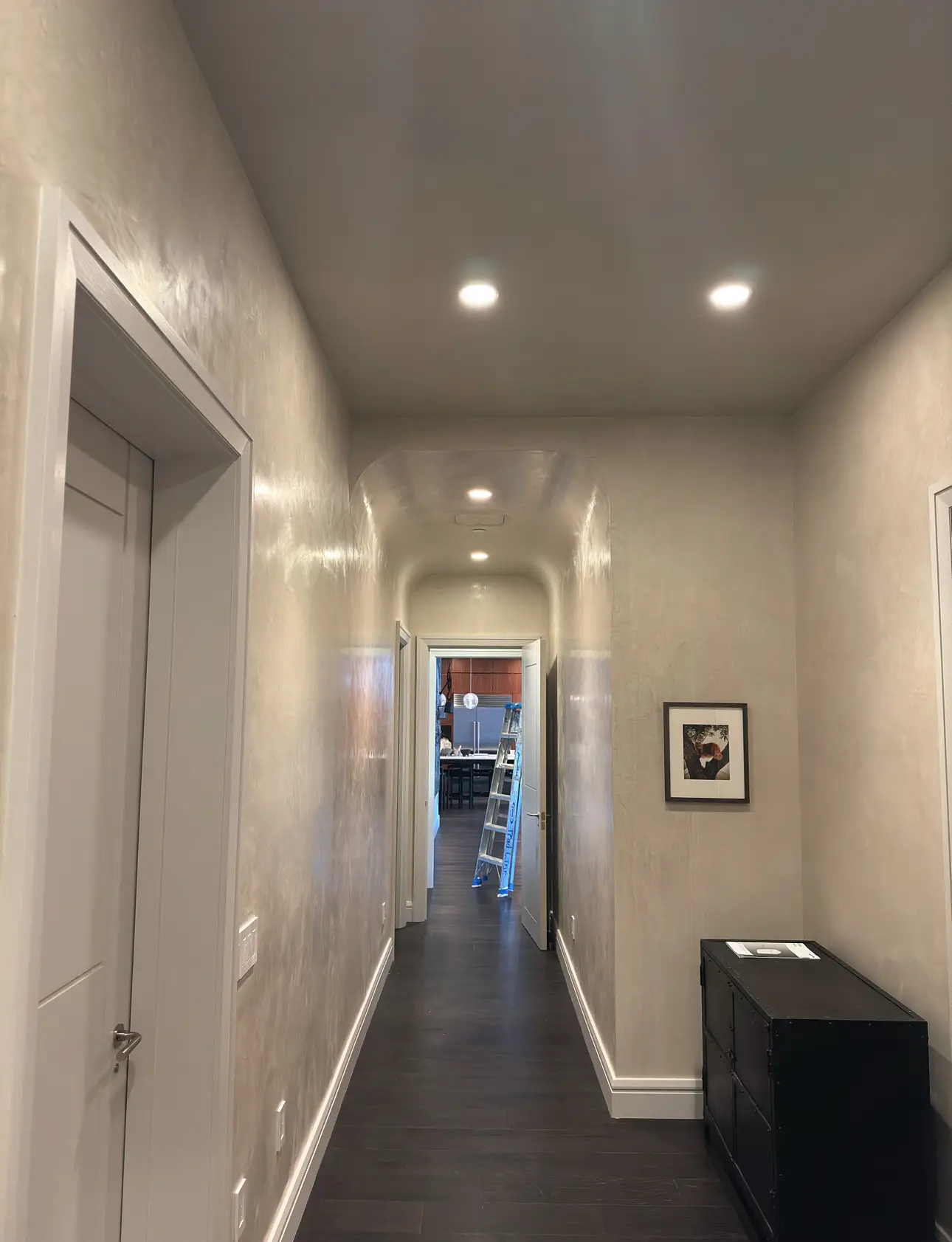 Laight St Residence — barrel-vaulted plaster corridor between rooms