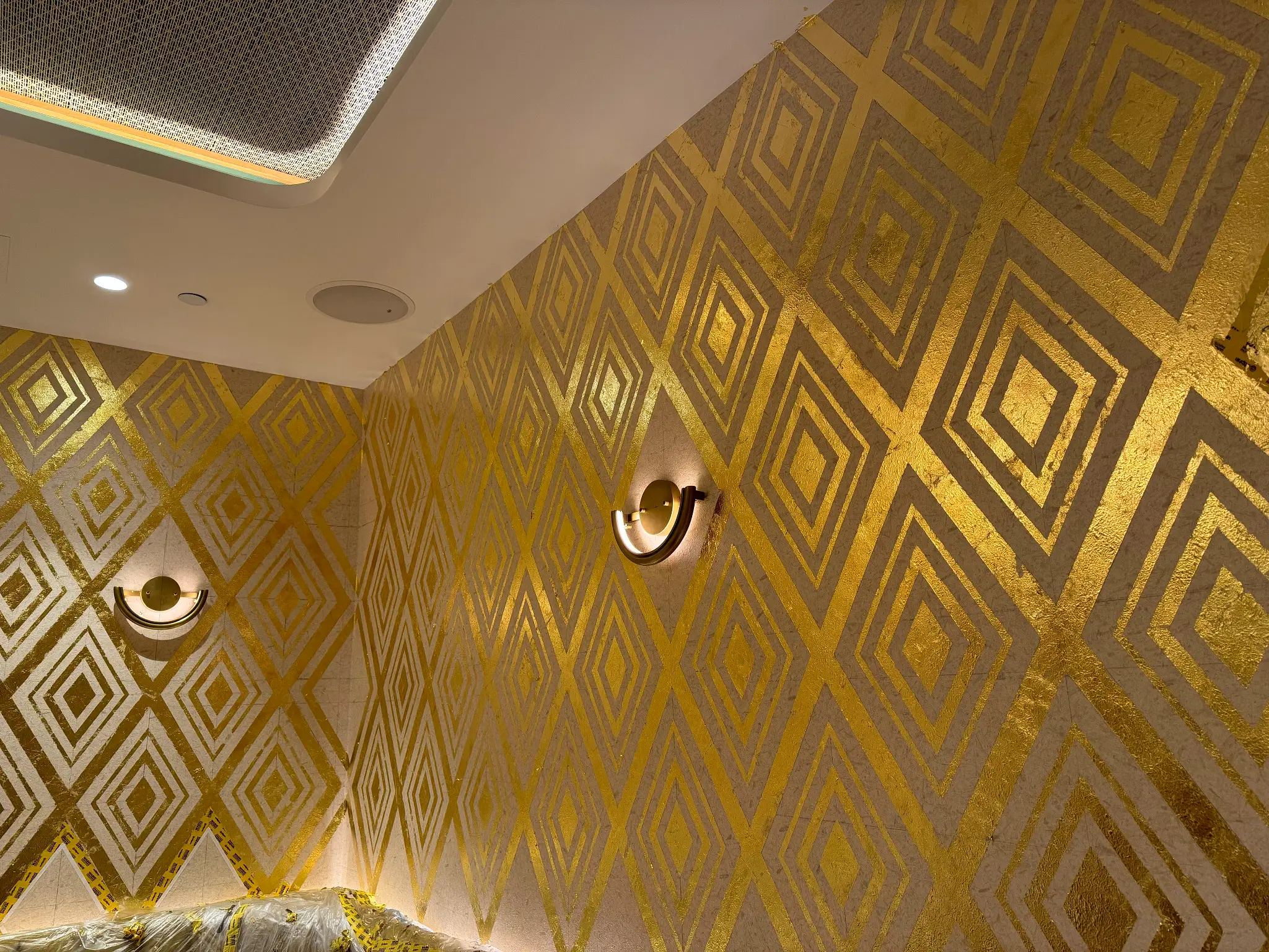 Friedmans — detail of gold leaf diamond pattern turning a corner