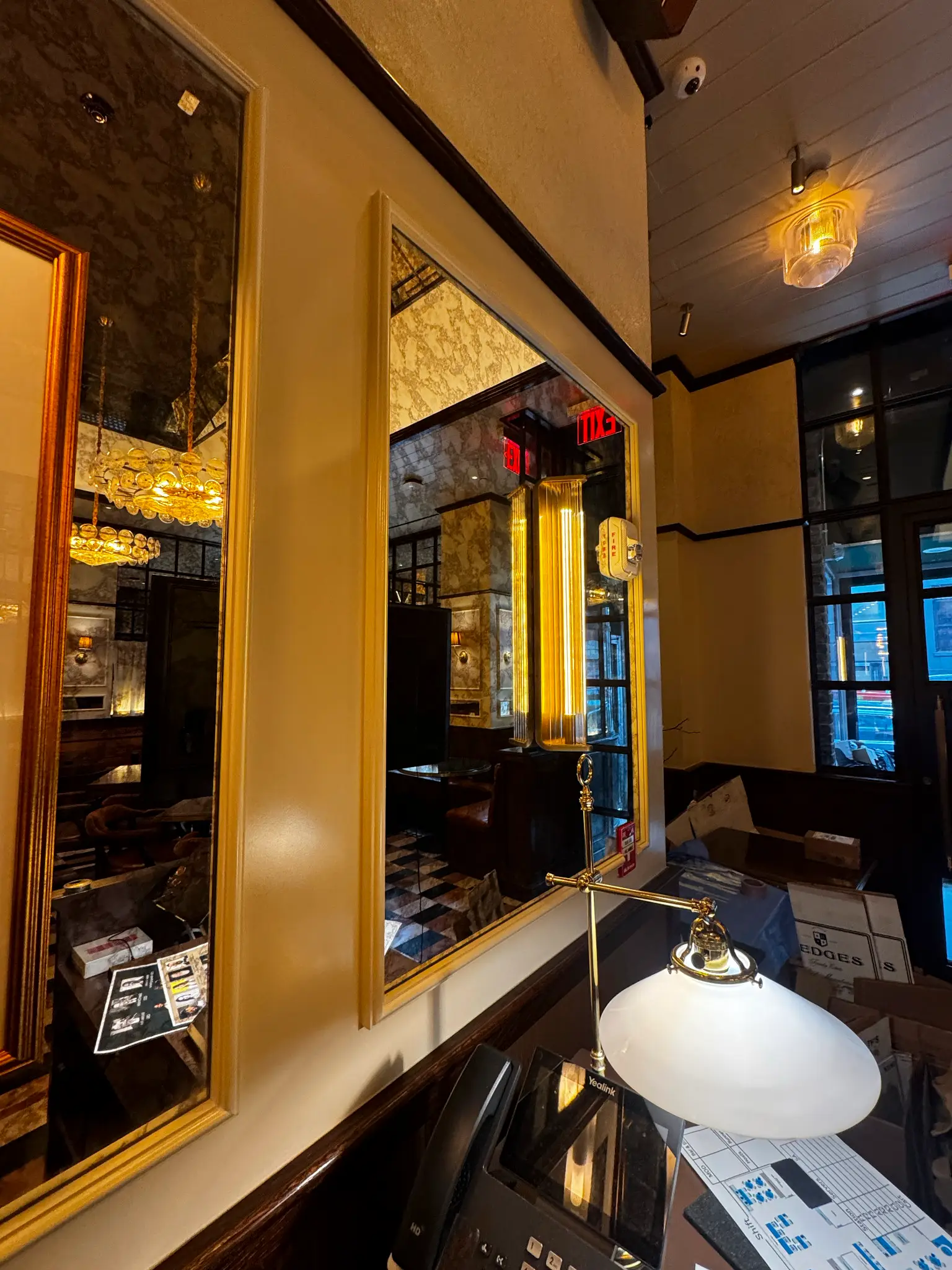 Carversteak NYC — antiqued mirror panels framed in gold venetian plaster